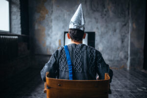 Image of man in tinfoil dunce cap